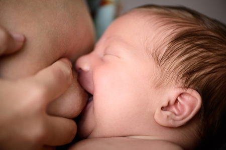 After childbirth newborn baby eats mammy breast milk