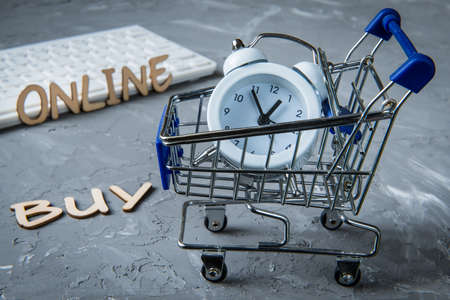 Buy Online Business Digital Technology Internet Concept - workplace office accessories - new timeの写真素材
