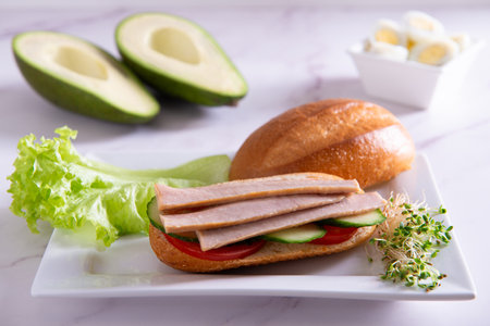tuna slices with fresh vegetables healthy food on a white plate closeupの写真素材