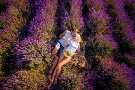 Happy couple in a field of lavenderの写真素材