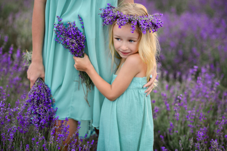 Mom and daughter in a field of lavender.の写真素材