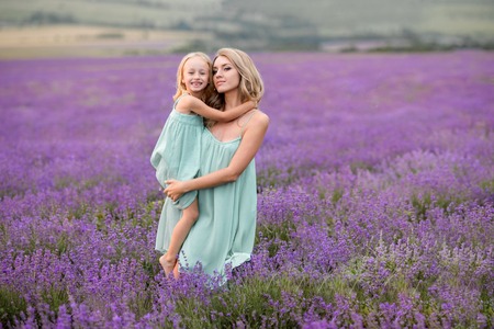 Mom and daughter in a field of lavender.の写真素材