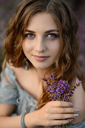 Woman in amazing dress walk on the lavender field.の写真素材