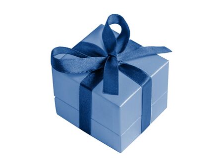 Gift box with ribbon in modern classic blue color isolated on white background. Surprise present concept.の写真素材