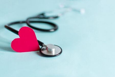 Doctor's stethoscope with red heart. Healthcare medical concept. Copy space.の写真素材