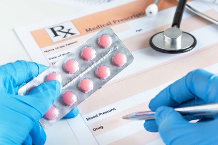 Medical prescription with doctor's sthetoscope and pills closeup.の写真素材