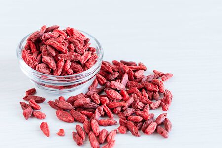 Bowl of dried goji berries on white background. Superfoods. Healthy eating concept.の写真素材