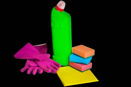 Composition of colorful cleaning supplies isolated on the black background. Household cleaning supplies.の写真素材