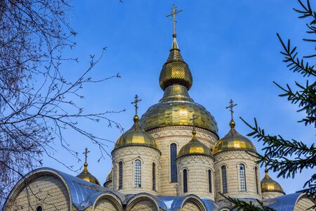 Gold cupola of the church on the blue sky background. Religion concept.の写真素材