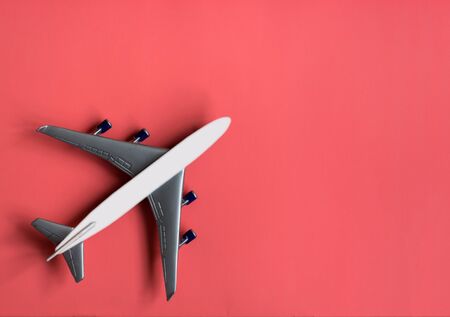 Model plane on pastel color background. Toy airplane. Travel concept. Illustration of plane .の写真素材