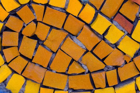 Texture of colorful retro mosaic tile. Vintage colorful brick wall background.の写真素材