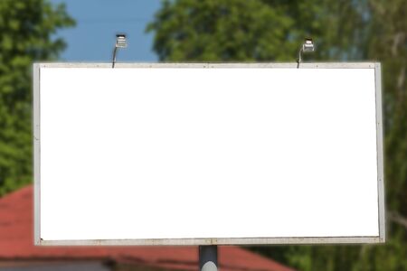 Blank advertisement board on the street of the city. Mockup for design. Empty ad banner outdoor.の写真素材