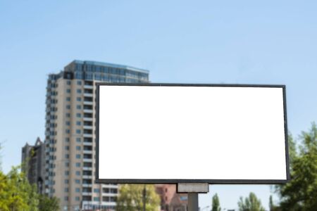 Blank advertisement board on the street of the city. Mockup for design. Empty ad banner outdoor.の写真素材