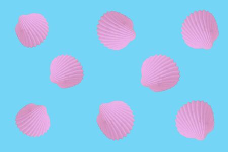 Creative pastel colorful composition with oyster shells. Bright unusual summer concept.の写真素材