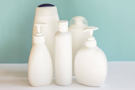 Blank plastic bottles on pastel modern interior. Hygiene cosmetic concept.の写真素材