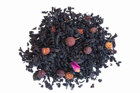 Heap of aromatic tea isolated on white background. Black tea with fruits and flowers.の写真素材