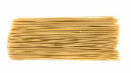 Spaghetti raw isolated on white background. Uncooked italian pasta.Heap of macaroni.の写真素材