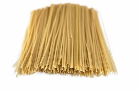 Spaghetti raw isolated on white background. Uncooked italian pasta.Heap of macaroni.の写真素材