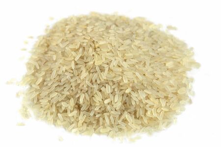 Heap of rice isolated on white backgroung. Asian ingredient for cooking.の写真素材