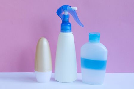 Blank plastic bottles on pastel modern interior. Hygiene cosmetic concept.の写真素材
