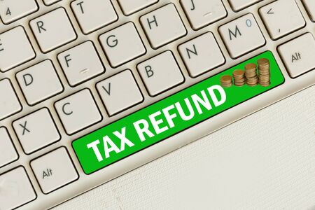 Tax refund concept. Laptop keyboard top view.の写真素材