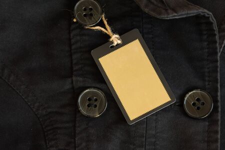 Blank label on black coat. Empty label. Mockup for design.の写真素材