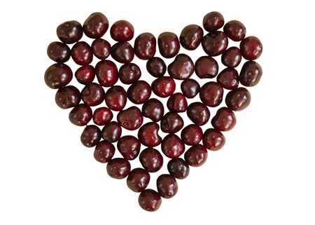 Cherry heart shape isolated on white background. Sweet love concept.の写真素材