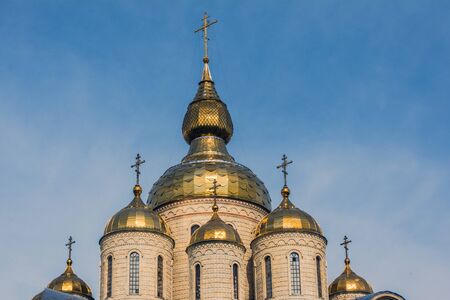 Gold cupola of the church on the blue sky background. Religion concept.の写真素材