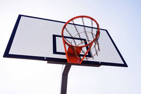 Basketball hoop basket and board on the blue sky background outdoors. Basketball court.の写真素材