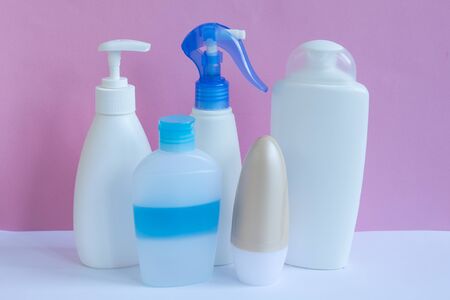 Blank plastic bottles on pastel modern interior. Hygiene cosmetic concept.の写真素材
