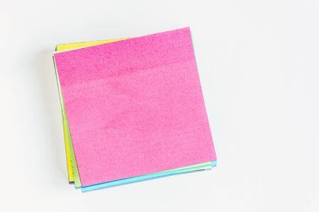 Colorful office stickers isolated on white background. Stack of memo notepaper.の写真素材
