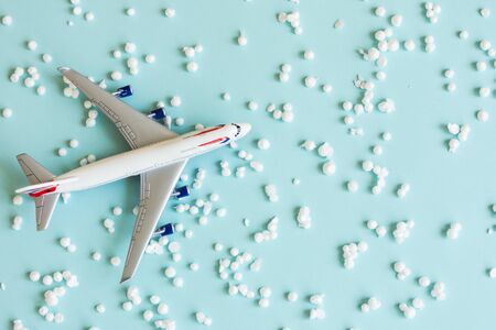 Model plane on pastel creative background. Toy airplane.