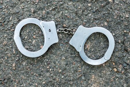Handcuffs top view. Enforcement and punishment. Criminal concept.の写真素材