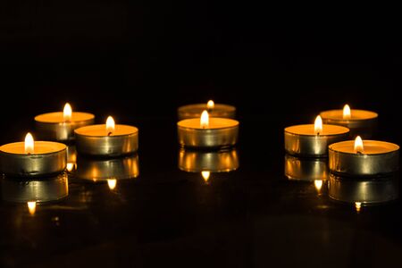 Light of candle flame. Romantic holiday candles burning .の写真素材