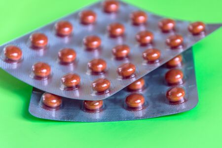 Pills on pastel color background. Medical treatment concept. Copy space. Mockup for design.の写真素材