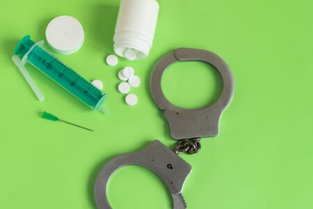 Drugs and handcuffs composition. Crime concept.の写真素材