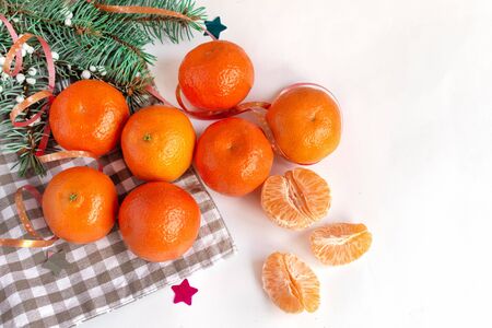 Mandarins fruits top view on white decorated table background. Healthy vitamins eating.の写真素材
