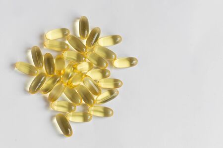 Capsules of fish oil vitamins Omega3 on white background. Healthy leaving. Health care concept.の写真素材