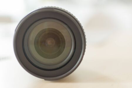 Modern digital camera lense closeup. Black camera lense. Copy space for design.
