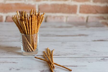 Salted bread sticks, salted straw snack. Crispy bread straw.の写真素材