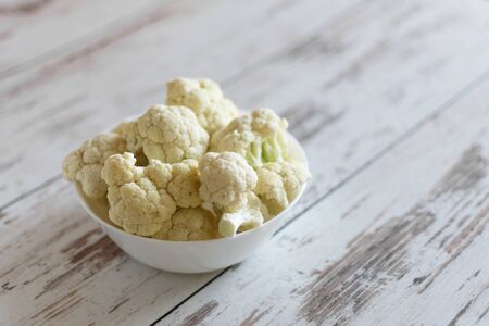 Fresh organic cauliflower on wooden background.の写真素材