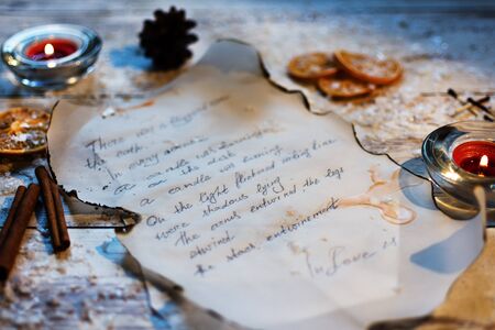 Fragment of an old handwritten letter on parchment. Winter atmosphere. Christmas time.