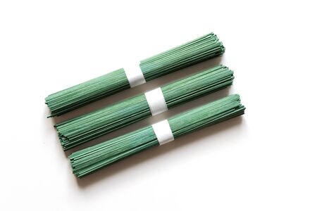 Raw vegan noodles soba with spirulina isolated on white background. Traditional Japanese food. Top...