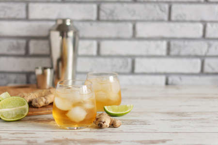 Fresh Ginger Ale with lime and ice or Kombucha in Bottle - Homemade lemon and ginger organic probiotic drink, copy space.の写真素材