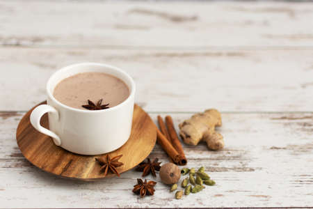 Masala chai made by brewing black tea with aromatic spices and herbs, such as Cinnamon Stick, Thai Cardamom, Ginger, Star Anise, Black Peppercorns, Nutmeg and Black Tea. Traditional indian masala tea.