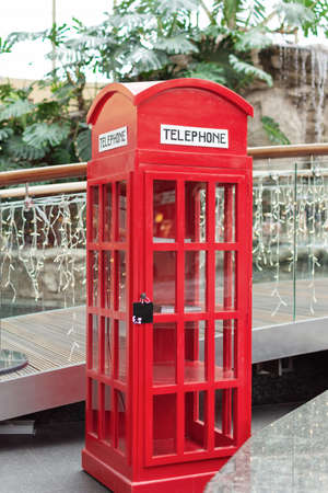 London style red public telephone booth indoor on Christmas time.の写真素材