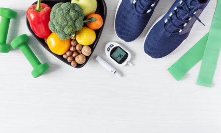 Healthy eating and sport plan for diabetes patients top view on white wooden table. Diabetes concept...