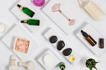 Natural cosmetics for skin care on white modern background top view. Bottles of organic spa beauty treatment products.の写真素材