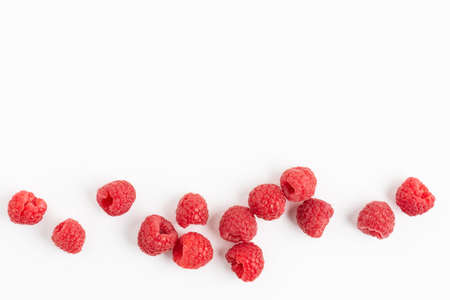 Fresh raspberries background top view. White background with raspberry berries. Summertime.