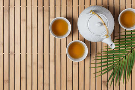 White teapot and tea cups with tea drink top view.  Asian tea ceremony.の写真素材